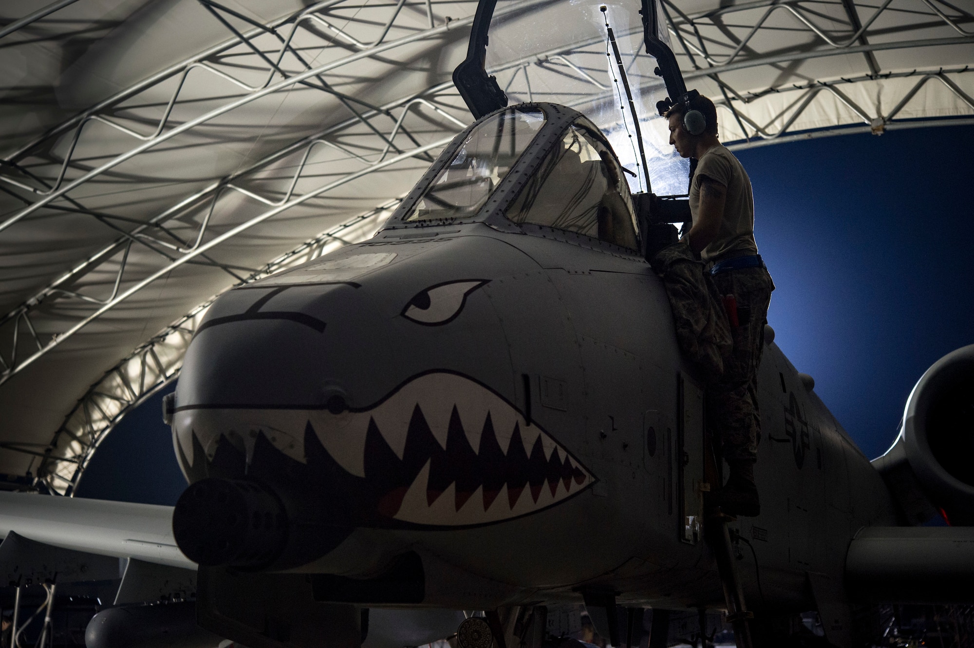 Senior Airman Michael Atkinson, 74th Aircraft Maintenance Unit dedicated crew chief, assists an A-10C Thunderbolt II pilot, July 9, 2018, at Moody Air Force Base, Ga. Airmen from the 75th Fighter Squadron (FS) and supporting units deployed to an undisclosed location in support of Operation Spartan Shield. (U.S. Air Force photo by Andrea Jenkins)