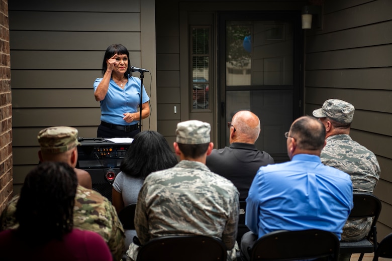 Dorothy Molina, Balfour Beatty Communities community manager, kicks off a ceremony celebrating the final housing unit renovations being completed at Chavez West base housing on Cannon Air Force Base, N.M., July 17, 2018. This project spanned the course of four years and saw 679 new homes built and 359 renovations to existing homes completed. (U.S. Air Force Photo by Staff Sgt. Charles Dickens)
