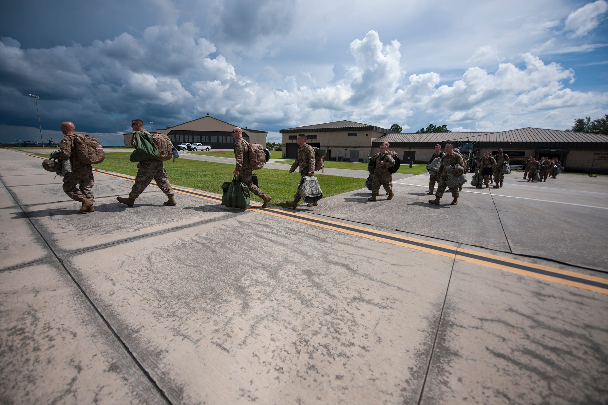 Airmen in support of the 75th Fighter Squadron (FS) board a C-17 Globemaster III, July 5, 2018, at Moody Air Force Base, Ga. The 75th FS and supporting units recently deployed to and undisclosed location in Southwest Asia. While deployed, the 75th FS will provide close air support missions through the A-10 Thunderbolt II, which is specifically designed for long loiter time, accurate weapons delivery, austere field capability and survivability. (U.S. Air Force photo by Airman Taryn Butler)