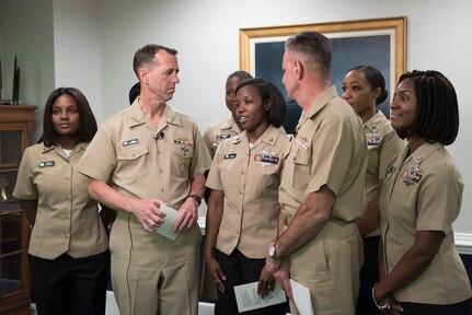 Chief of Naval Operations Adm. John M. Richardson (center left) and Chief of Naval Personnel Vice Adm. Robert P. Burke (center right) and Sailors assigned to the Pentagon announce new grooming standards on camera during a live all-hands call. The event was held to answer questions from the fleet and to announce upcoming changes and updates to Navy policies.