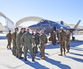F-35B pilot instructor Maj. A. C. Liberman greets Yuma-based Marines upon his arrival  to Marine Corps Air Station Yuma after flying in Third Marine Aircraft Wing's first F-35B to the station flightline, Nov. 16. The arrival of the aircraft marks the beginning of a new chapter in Marine Corps aviation history, bringing the latest and greatest aircraft in the world to the tip of America's expeditionary spear.  The arrival of the F-35B to MCAS Yuma highlights next week's official re-designation of Marine All Weather Fighter Attack Squadron 121, an F/A-18 Hornet Squadron, as the world's first operational F-35 squadron at MCAS Yuma.  MCAS Yuma is scheduled to receive four operational squadrons consisting of up to 16 aircraft plus one Operational Testing and Evaluation (OT&E) squadron with up to 8 aircraft.