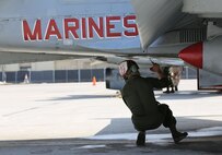 A power line mechanic with Marine Fighter Attack Squadron 232 preforms a maintenance check on an F/A-18C Hornet on the flight line aboard Mountain Home Air Force Base, Idaho, July 26.  Power line mechanics and other maintainers make sure every F/A-18C Hornet is ready and safe for flight.
