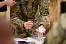 U.S. Army Pvt. Harland Bowden, 344th Military Intelligence Battalion student, performs a magic trick during the semi-annual Goodfellow’s Got Talent show at the Crossroads Student Ministry Center on Goodfellow Air Force Base, Texas, July 13, 2018. The students performed their unique skills before their peers and judges. (U.S. Air Force photo by Senior Airman Randall Moose/Released)