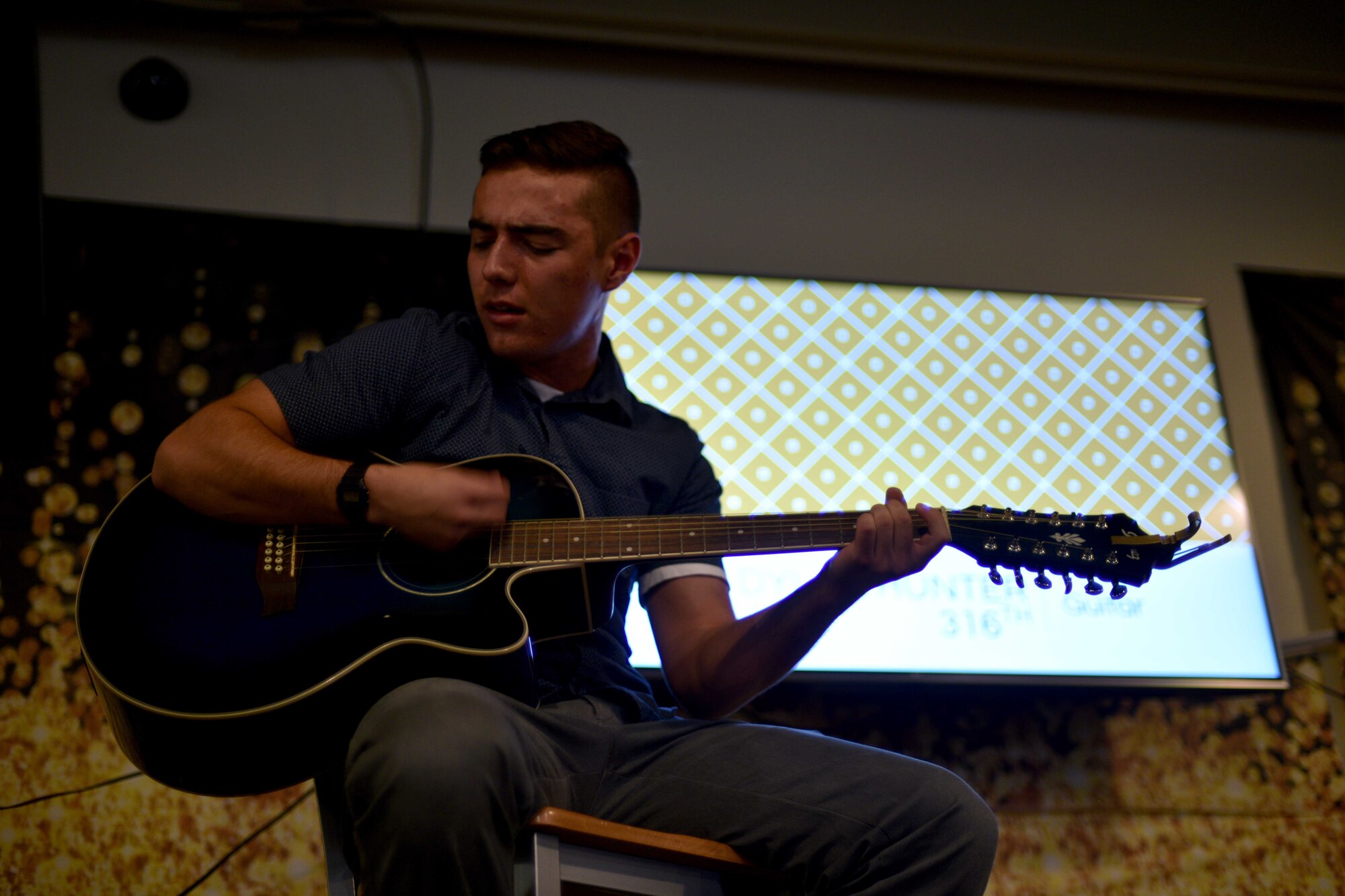 U.S. Air Force Airman 1st Class Dylan Hunter, 316th Training Squadron student, performs an original song during the semi-annual Goodfellow’s Got Talent show at the Crossroads Student Ministry Center on Goodfellow Air Force Base, Texas, July 13, 2018. Hunter won third place for his performance. (U.S. Air Force photo by Senior Airman Randall Moose/Released)