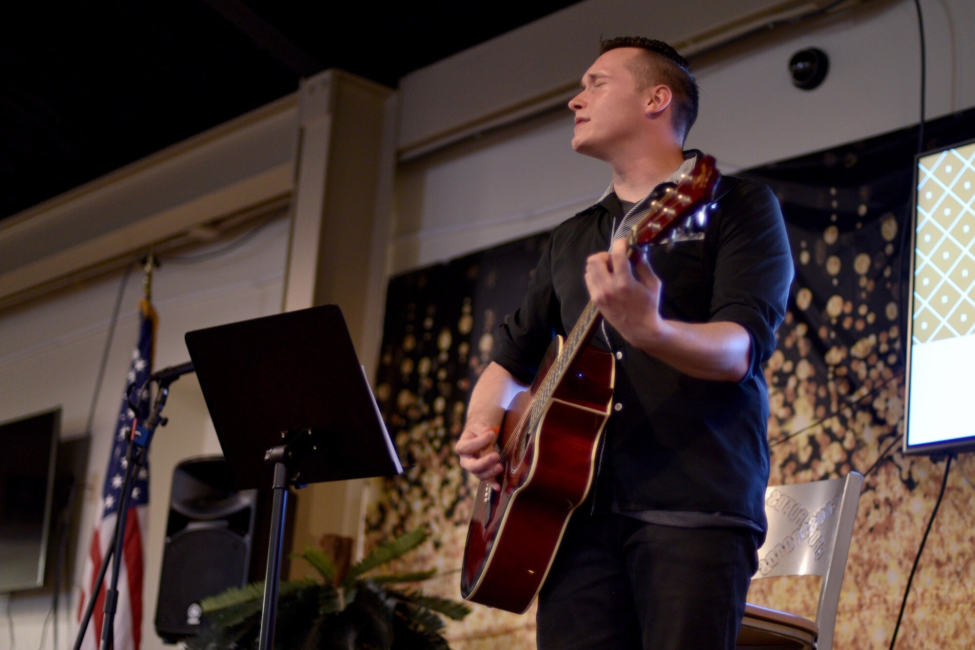 U.S. Army Pvt. Gabriel Augustinowicz, 344th Military Intelligence Battalion student, performs a song during the semi-annual Goodfellow’s Got Talent show at the Crossroads Student Ministry Center on Goodfellow Air Force Base, Texas, July 13, 2018. The Crossroads Student Ministry Center provides the students a place to socialize, relax and seek mentorship from the Chaplains. (U.S. Air Force photo by Senior Airman Randall Moose/Released)