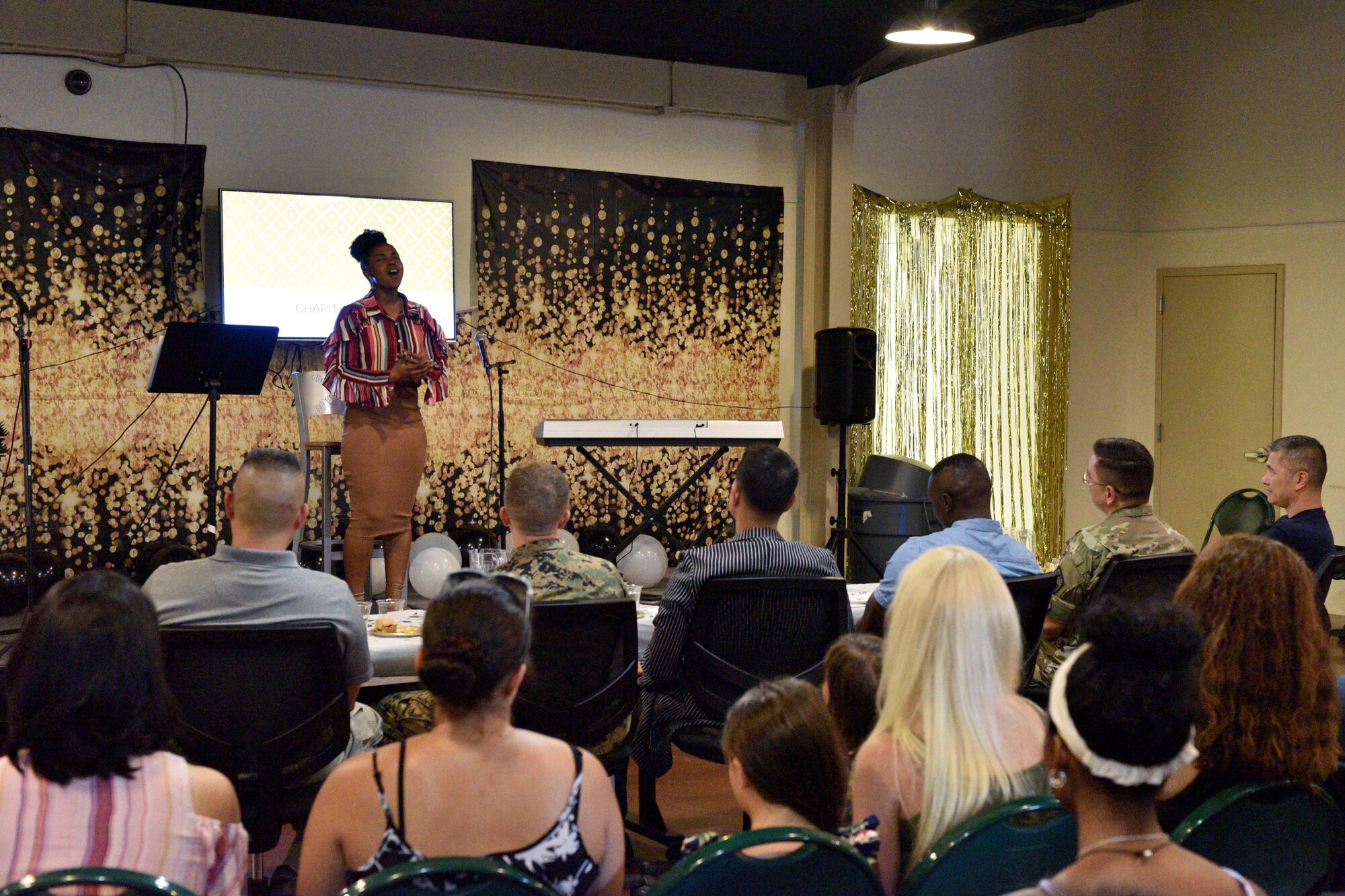U.S. Army Pfc. Charity Mack, 344th Military Intelligence Battalion student, sings during the semi-annual Goodfellow’s Got Talent show at the Crossroads Student Ministry Center on Goodfellow Air Force Base, Texas, July 13, 2018. The participants showcased a variety of talents, including, magic tricks, singing, guitar, piano and poetry. (U.S. Air Force photo by Senior Airman Randall Moose/Released)