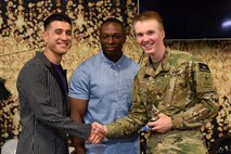 U.S. Air Force Col. Ricky Mills, 17th Training Wing commander and Chief Master Sgt. Lavor Kirkpatrick, 17th TRW command chief, present U.S. Army Pvt. John Zeigler’s, 344th Military Intelligence Battalion student, an award for the semi-annual Goodfellow’s Got Talent show at the Crossroads Student Ministry Center on Goodfellow Air Force Base, Texas, July 13, 2018. Zeigler won first place for his performance. (U.S. Air Force photo by Senior Airman Randall Moose/Released)