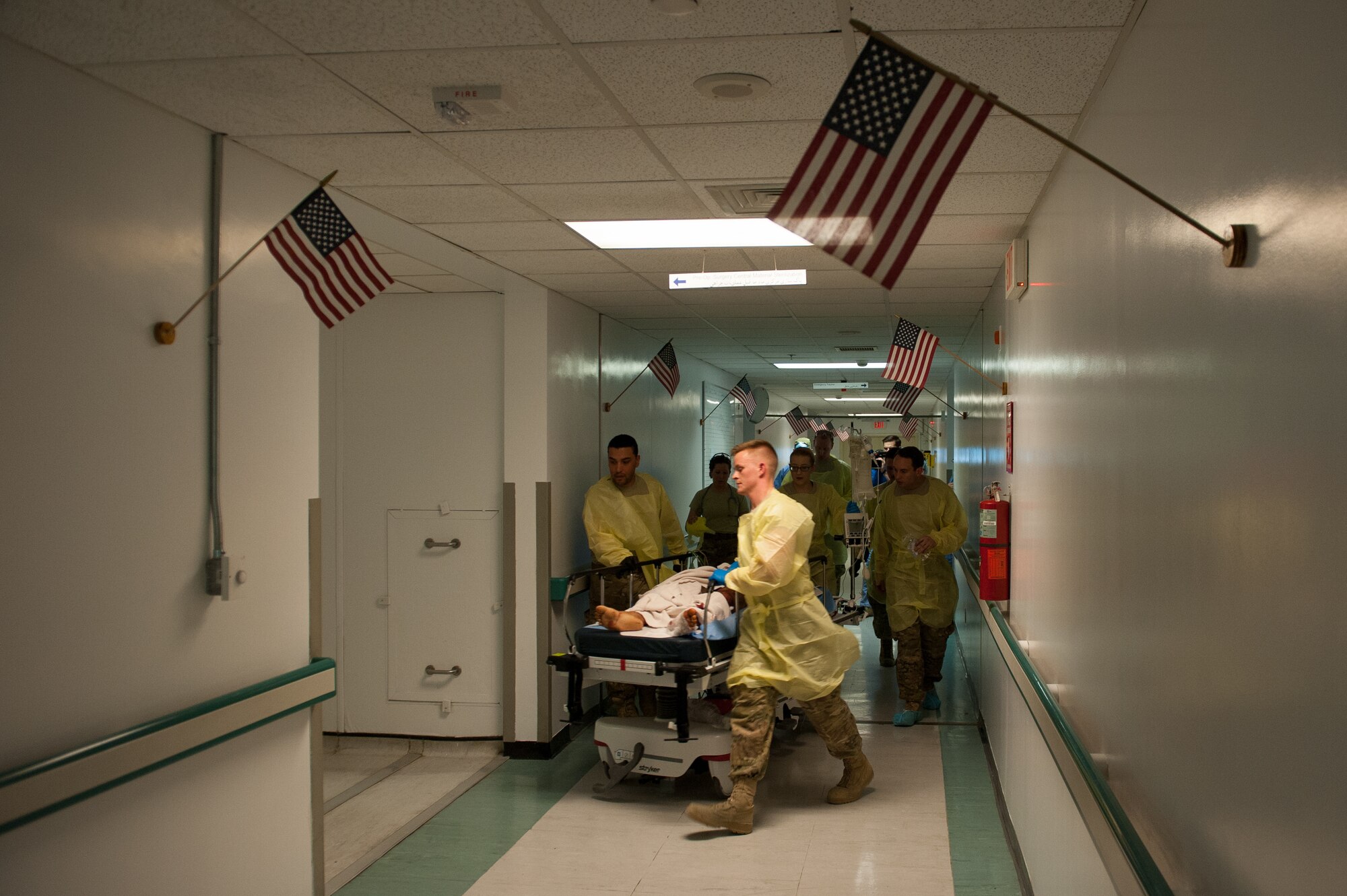 U.S. Airmen assigned to the 455th Expeditionary Medical Group transport an Afghan National Defense and Security Forces soldier who sustained trauma from a gunshot to the operating room at the Craig Joint Theater Hospital, Bagram Air Field, Afghanistan, Sept. 26, 2015. The CJTH provides surgical capabilities in trauma, general surgery, orthopedics, neurosurgery, urology, vascular surgery and otolaryngology, all of which are critical to helping 98 percent of patients who come to the hospital survive their injuries. (U.S. Air Force photo by Tech. Sgt. Joseph Swafford/Released)