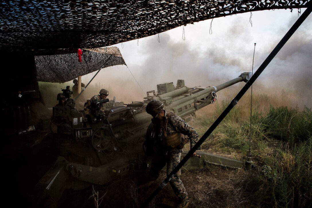 U.S. Marines deliver the boom during RIMPAC