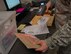 Airman 1st Class Noah Carlton, 60th Force Support Squadron, scans a label on a parcel, May 5, 2018, Travis Air Force Base, Calif. The 60 FSS Official Mail Center is responsible for processing mail for Travis AFB, David Grant USAF Medical Center, and commercial company deliveries. (U.S. Air Force Photo by Heide Couch)