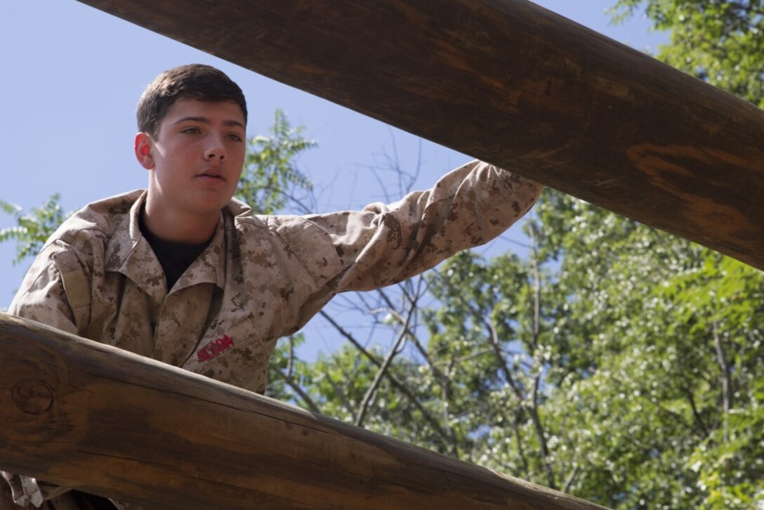Ty Schlogl, a student at Ticonderoga High School in Ticonderoga, New York, navigates the confidence course during Marine Corps Recruiting Command’s 2018 Summer Leadership and Character Development Academy aboard Officer Candidates School, Marine Corps Base Quantico, Virginia, July 18. Students accepted into the academy were hand-selected by a board of Marines who look to find attendees with similar character traits as Marines. Inspired by the Marine Corps' third promise of developing quality citizens, the program was designed to challenge and develop the nation's top-performing high school students so they could return to their communities more confident, selfless and better equipped to improve the lives of those around them. (U.S. Marine Corps photo by LCpl. Mitchell Collyer)