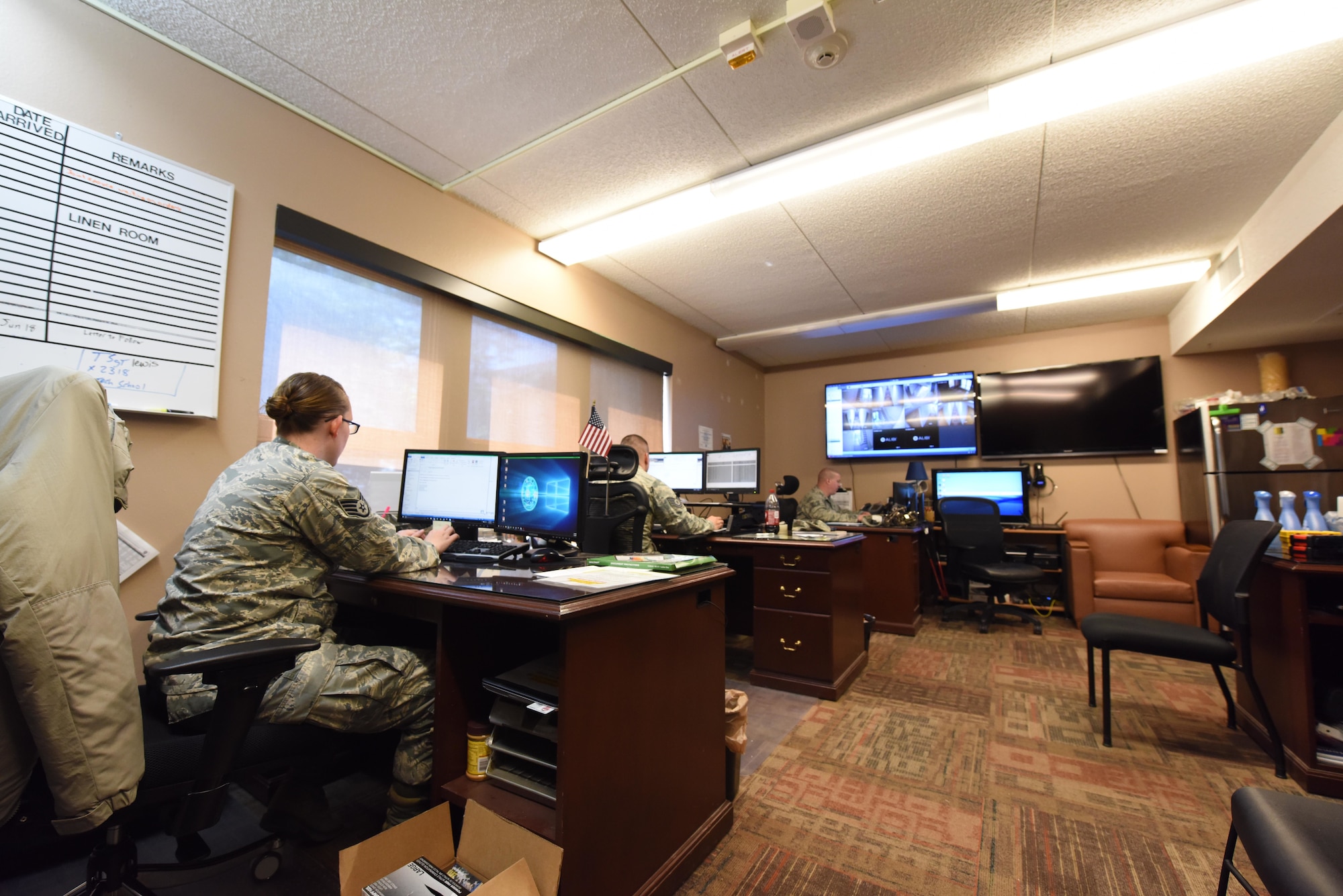 Airman dorm leaders work on their computers at Ellsworth Air Force Base, S.D., July 16, 2018. Airman dorm leaders are preparing for a new dorm to be finished in January 2019, which will provide new housing for more than 120 Airmen. (U.S. Air Force photo by Airman 1st Class Thomas Karol)