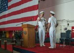 PHILIPPINE SEA (July 18, 2018) Rear Adm. Karl O. Thomas, left, salutes Rear Adm. Marc Dalton during the Commander, Task Force (CTF) 70 change of command ceremony in the hangar bay aboard the aircraft carrier USS Ronald Reagan (CVN 76). Thomas relieved Dalton as commander, CTF 70. CTF 70 is forward-deployed to the U.S. 7th Fleet area of operations in support of security and stability in the Indo-Pacific region.