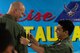 Royal Malaysian air force (RMAF) Lt. Col. Syed Faisal, RMAF exercise director, places a patch on U.S. Air Force Lt. Col. Barry King II, U.S. Air Force exercise director, during the Cope Taufan 18 opening ceremony at Subang Air Base, Malaysia, July 13, 2018.