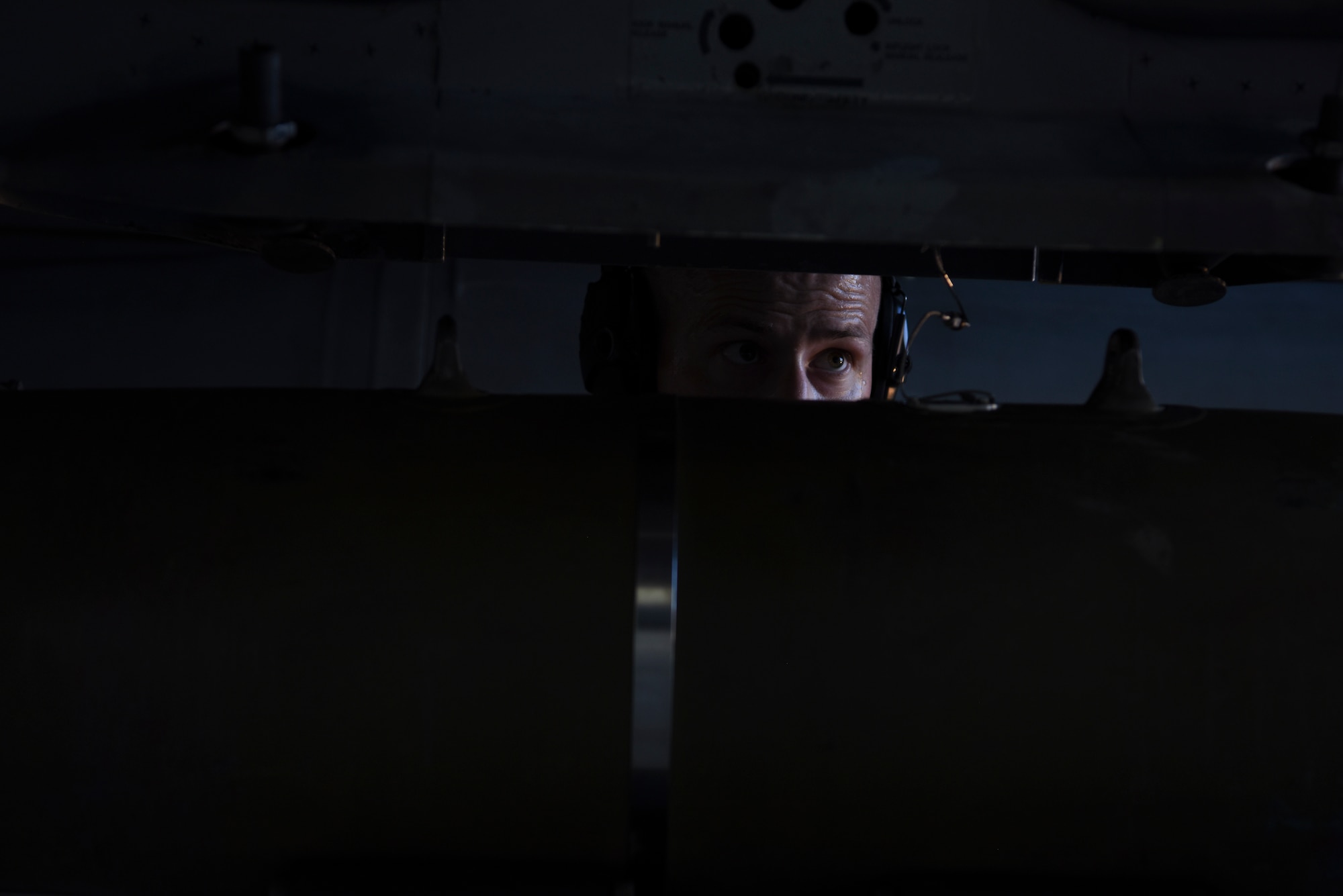 U.S. Air Force Staff Sgt. Bryan Everidge, 80th Aircraft Maintenance Unit weapons load crew chief, locks in a GBU-54 onto the bomb rack during the 8th Maintenance Group's 2nd Quarter Weapons Loading Competition at Kunsan Air Base, Republic of Korea, July 13, 2018. This competition showcased the Airmen ability to execute operations with efficiency and timeliness.
