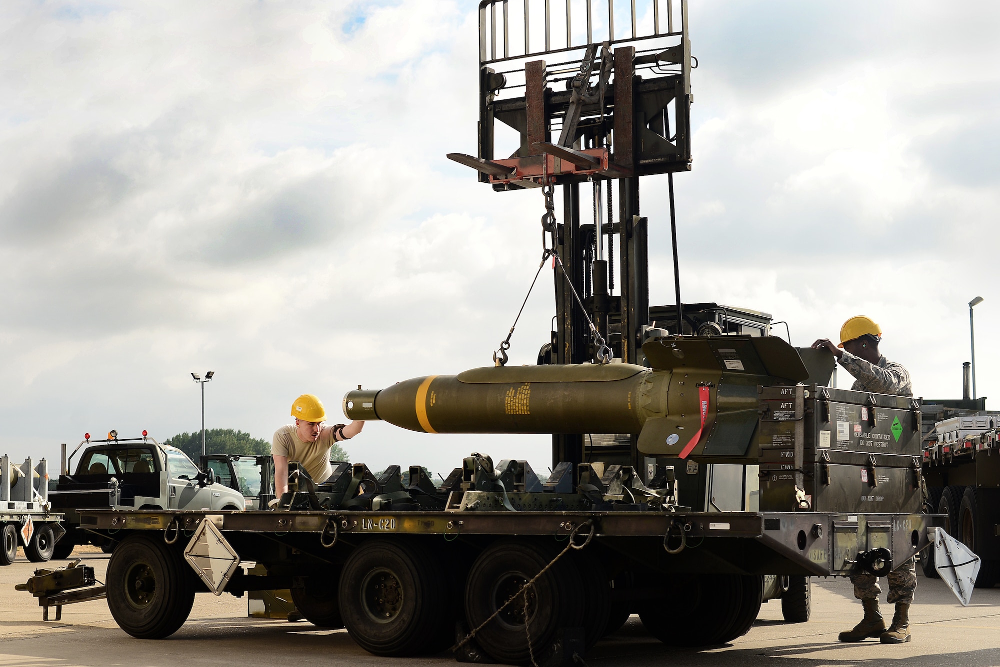 U.S. Air Force Munitions Airmen prepare a GBU-24 Paveway III laser-guided bomb for transport during the United States Air Forces in Europe-Air Forces Africa’s inaugural Combat Ammunition Production Exercise July 17, 2018. The 48th Fighter Wing Maintenance Group hosted approximately 160 Airmen from the 9th Munitions Squadron, Beale Air Force Base, Calif., 31st MXG, Aviano Air Base, Italy, 52nd MXG, Spangdahlem AB, Germany, 86th Logistics Readiness Group, Ramstein AB, Germany, and the 422nd Air Base Group, 501st Combat Support Wing, RAF Alconbury, England to participate in the training. (U.S. Air Force photo/ Tech. Sgt. Matthew Plew)