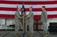 U.S. Air Force Col. Jason E. Bailey, 52nd Fighter Wing commander, left, passes the ceremonial guidon to Col. Greg Buckner, incoming 52nd Munitions Maintenance Group commander, right, during the 52 MMG change of command ceremony in Hangar 1 on Spangdahlem Air Base, Germany, July 17, 2018. (U.S. Air Force photo by Senior Airman Dawn M. Weber)