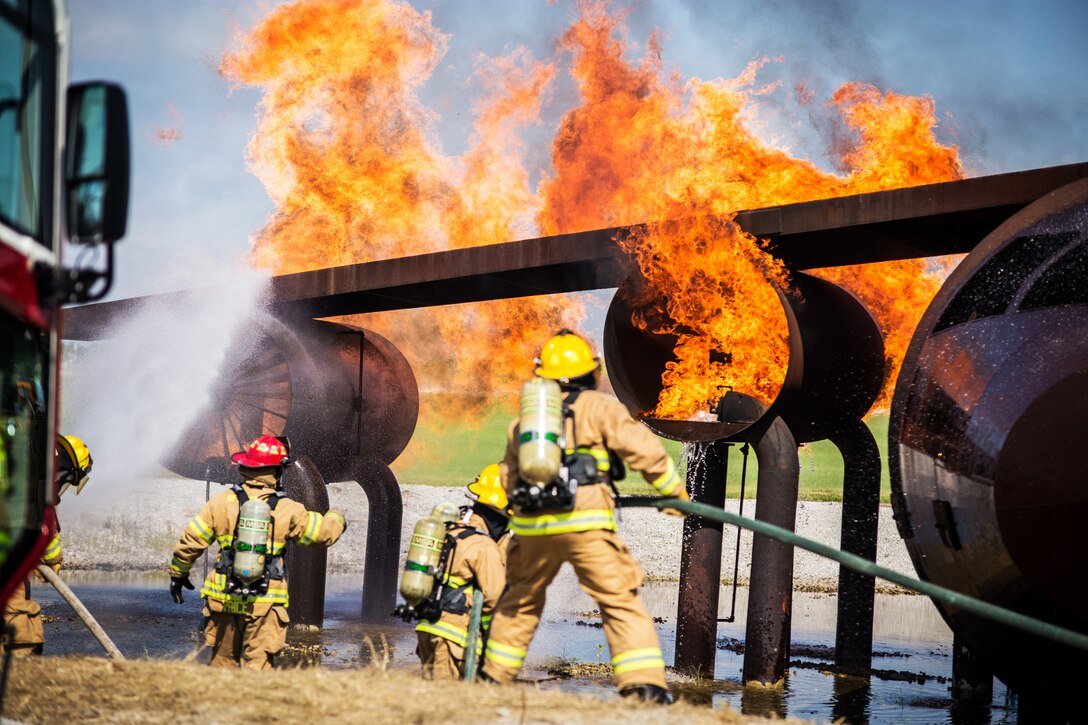 Missouri Air National Guard firefighters conduct an aircraft live-fire exercise.