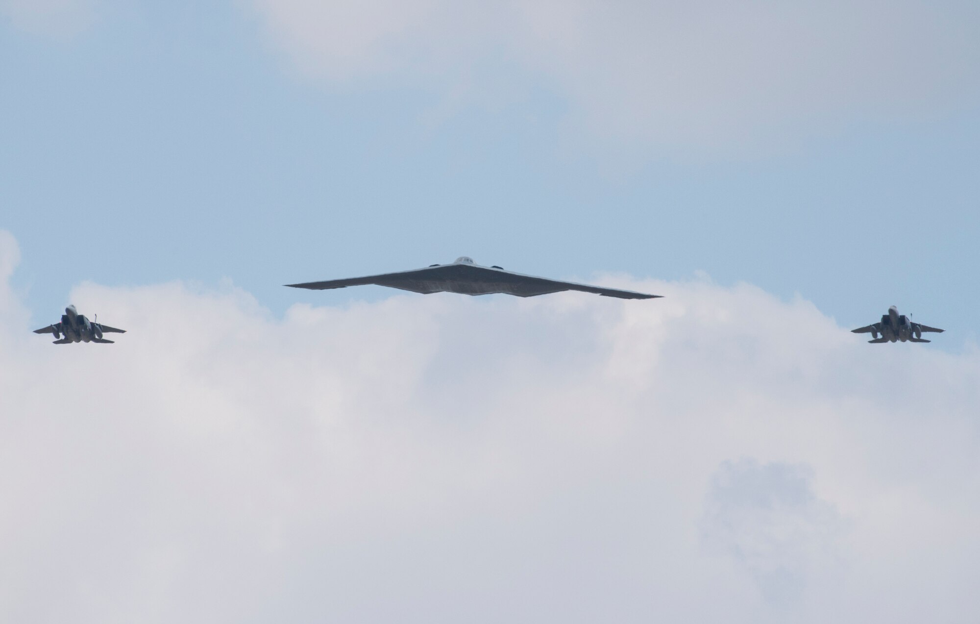 A U.S. Air Force B-2 Spirit and two F-15 Eagles fly past a crowd during the 2018 Royal International Air Tattoo (RIAT) at RAF Fairford, United Kingdom, July 14, 2018. This year’s RIAT celebrated the 100th anniversary of the RAF and highlighted the United States’ ever-strong alliance with the UK. (U.S. Air Force photo by Tech. Sgt. Brian Kimball)