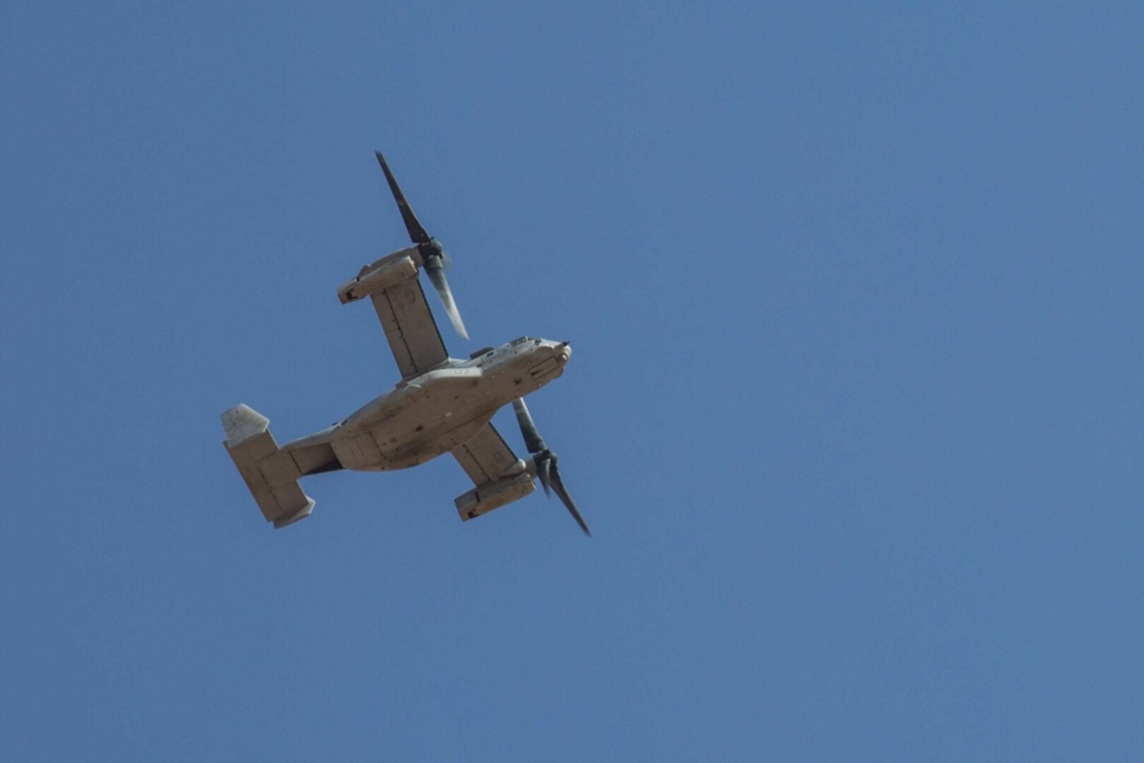 A U.S. Marine Corps MV-22B Osprey flies above the flight line in support of Combined Joint Task Force – Operation Inherent Resolve on Al Asad Air Base, Iraq, June 8, 2018. CTJF-OIR is the military arm of the Global Coalition to defeat ISIS in designated parts of Iraq and Syria.