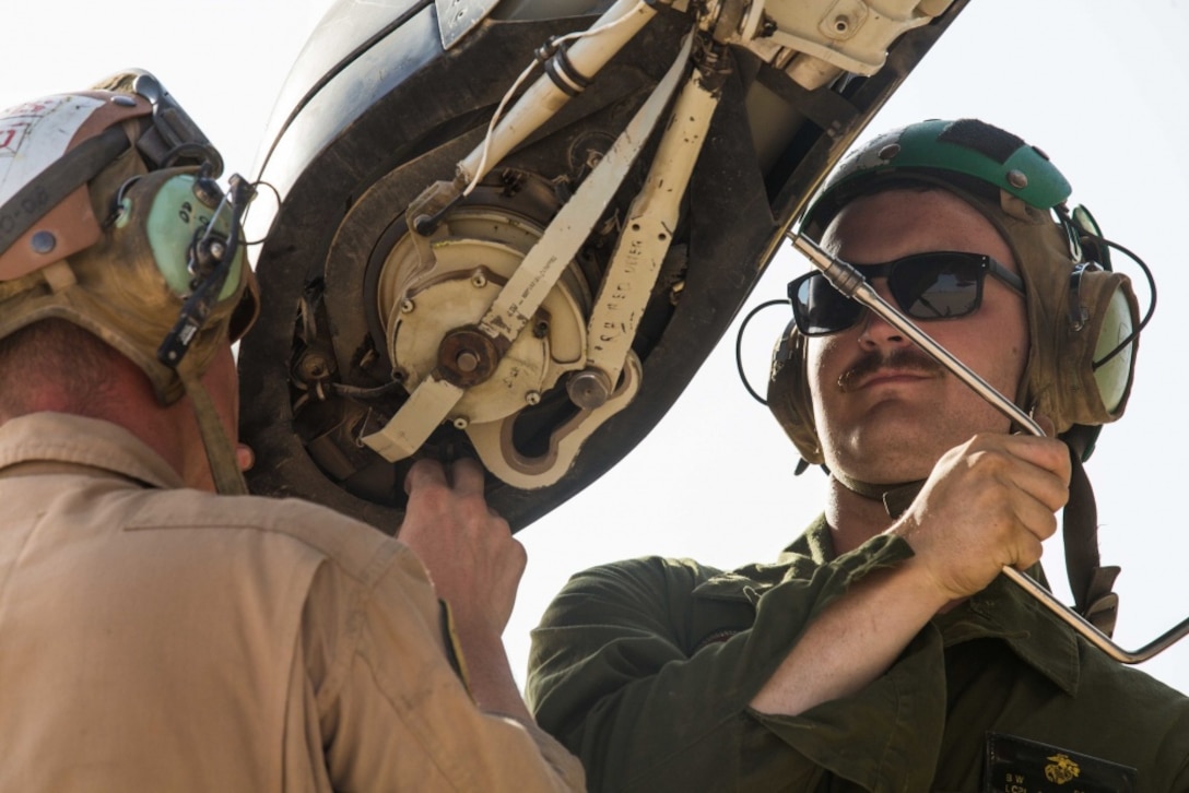 U.S. Marines perform routine maintenance on the rotor blade of an MV-22B Osprey during routine maintenance in support of Combined Joint Task Force – Operation Inherent Resolve on Al Asad Air Base, Iraq, June 8, 2018. CTJF-OIR is the military arm of the Global Coalition to defeat ISIS in designated parts of Iraq and Syria.