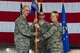 U.S. Air Force Col. Jason E. Bailey, 52nd Fighter Wing commander, left, passes the ceremonial guidon to Col. Marlyce K. Roth, incoming 52nd Mission Support Group commander, during the 52nd MSG change of command ceremony in Hangar 1 at Spangdahlem Air Base, Germany, July 19, 2018. (U.S. Air Force photo by Airman 1st Class Valerie Seelye)