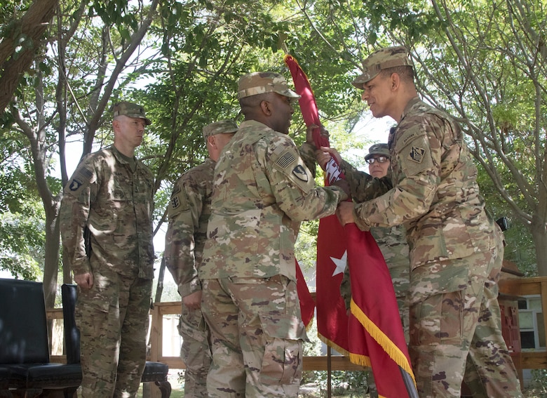 Col. Mark C. Quander, commander, USACE Transatlantic Division, charges Col. Jason E. Kelly with command of the Afghanistan Engineer District in a ceremony on Bagram Airfield June 28.
