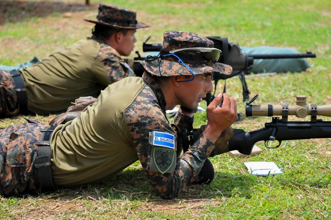 Military snipers from El Salvador take aim.