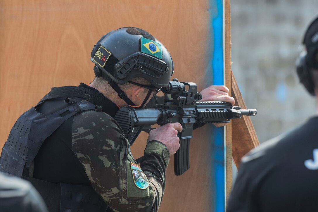 A Brazilian comando shoots targets as part of Fuerzas Comando