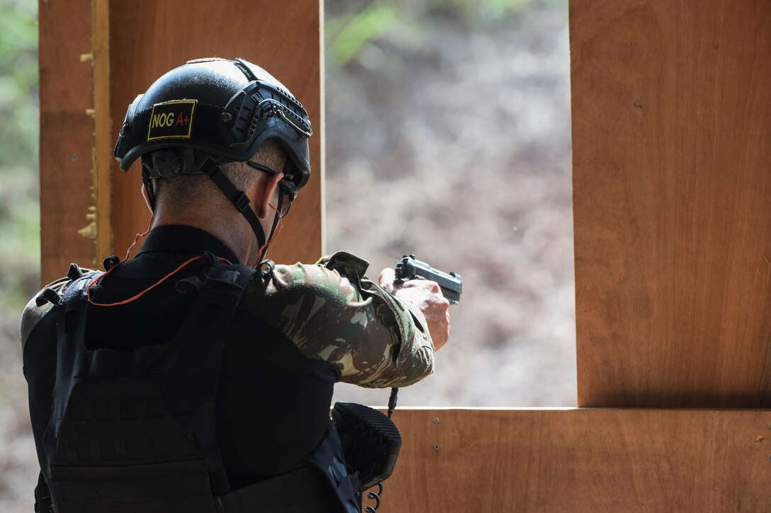 A Brazilian comando shoots targets as part of Fuerzas Comando