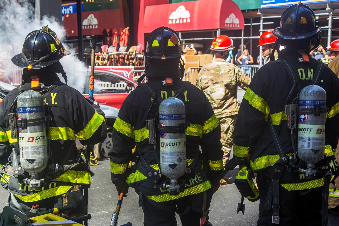 Firefighters train with soldiers.