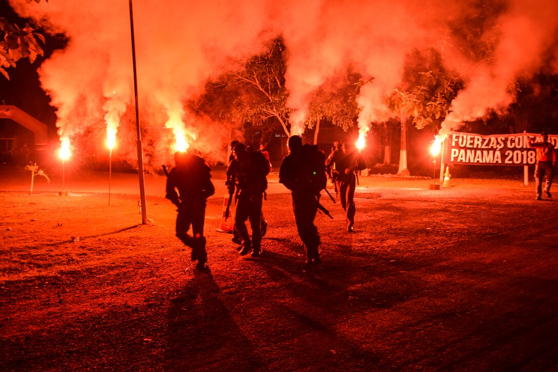 Comandos step off from the starting point of a 20-kilometer ruck march during Fuerzas Comando