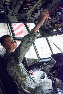 Senior Airman Travis Moore, 302nd Aircraft Maintenance Squadron communication and navigation systems specialist, checks controls inside a C-130 Hercules aircraft Aug. 20, 2018 at Peterson Air Force Base, Colorado. Moore was recently selected to attend the U.S. Air Force Academy Preparatory School through the Air Force’s Leaders Encouraging Airmen Development Program. (U.S. Air Force photo by Staff Sgt. Heather Heiney)