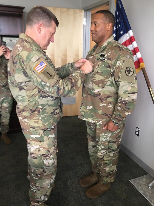 U.S. Army Reserve Maj. Gen. Mark Palzer, commanding general, 79th TSC, promotes Col. Vincent E. Buggs, incoming commander of the 364th ESC, to brigadier general in a ceremony held July 1, 2018, at the Marysville Armed Forces Reserve Center.