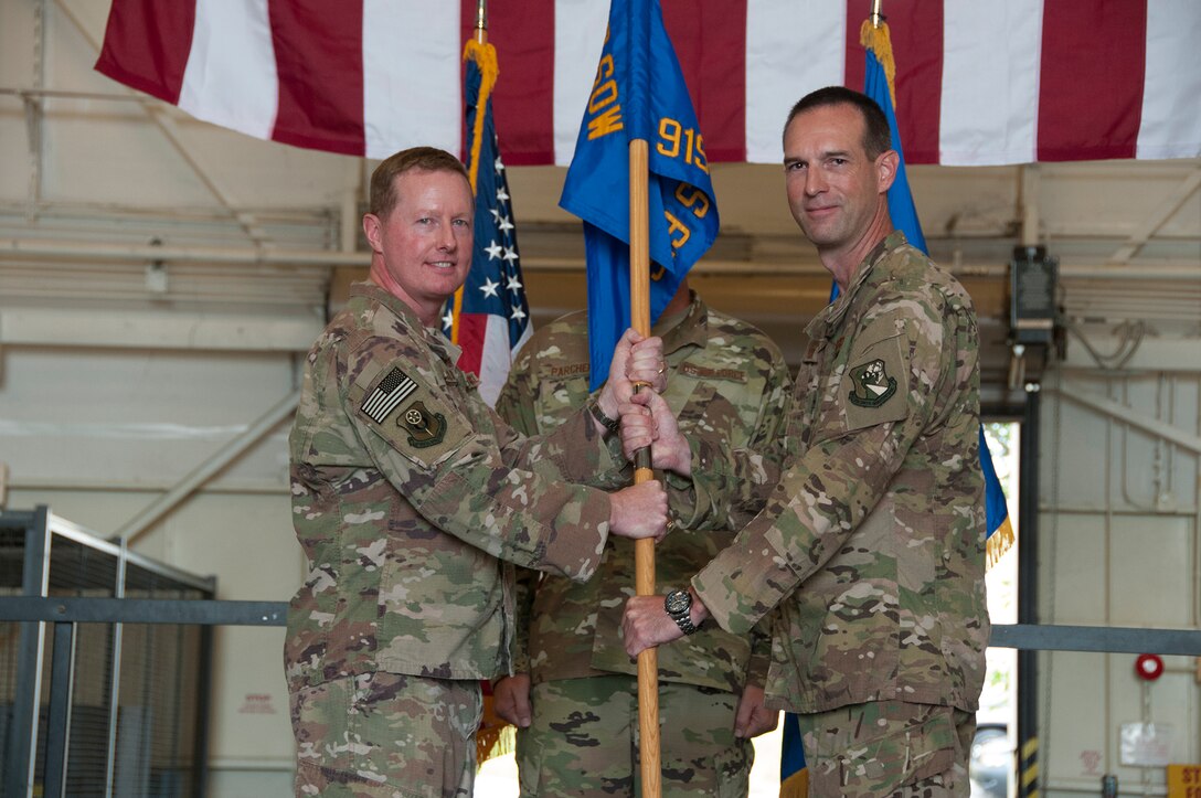 Col. Kristopher “Scot” Terry accepts command of the 919th Special Operations Maintenance Group from Col. Frank L. Bradfield III, 919th Special Operations Wing commander, in a ceremony at Duke Field, Florida, July 15, 2018.