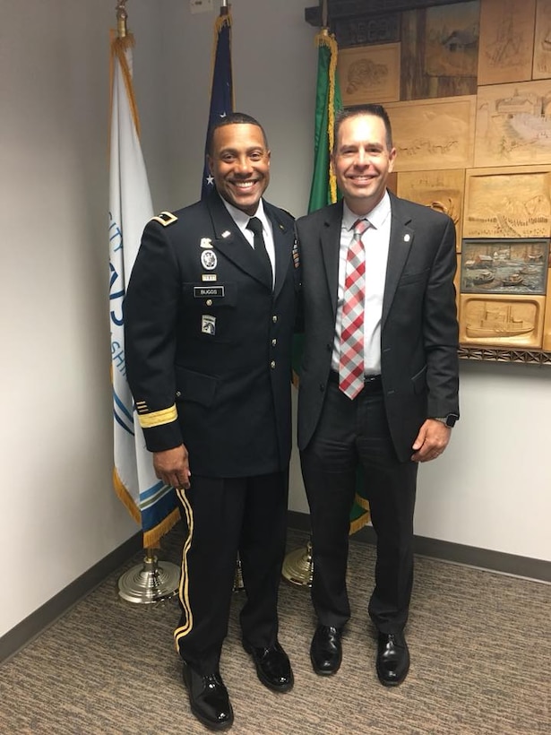 U.S. Army Reserve Brig. Gen. Vincent Buggs, commanding general, 364th Sustainment Command (Expeditionary), and Marysville Mayor Jon Nehring discuss important initiatives aimed to support local community and military families during an office call at Marysville City Hall, July 19, 2018. Families are critical in supporting Readiness as they support our Soldiers in accomplishing their mission.