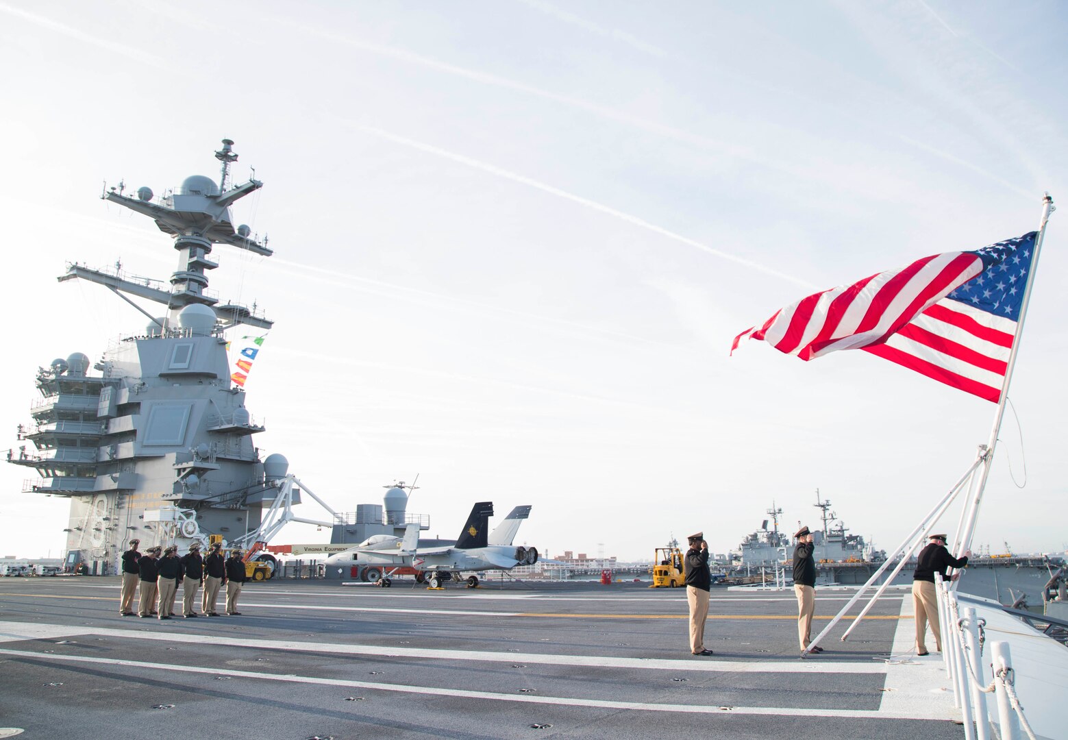 NORFOLK (April 1, 2018) Sailors assigned to the aircraft carrier USS Gerald R. Ford's (CVN 78) Chief's Mess conduct colors on the ship's flight deck in commemoration of the 125th anniversary of the chief petty officer rank.