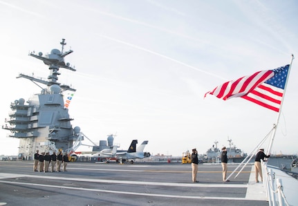 NORFOLK (April 1, 2018) Sailors assigned to the aircraft carrier USS Gerald R. Ford's (CVN 78) Chief's Mess conduct colors on the ship's flight deck in commemoration of the 125th anniversary of the chief petty officer rank.