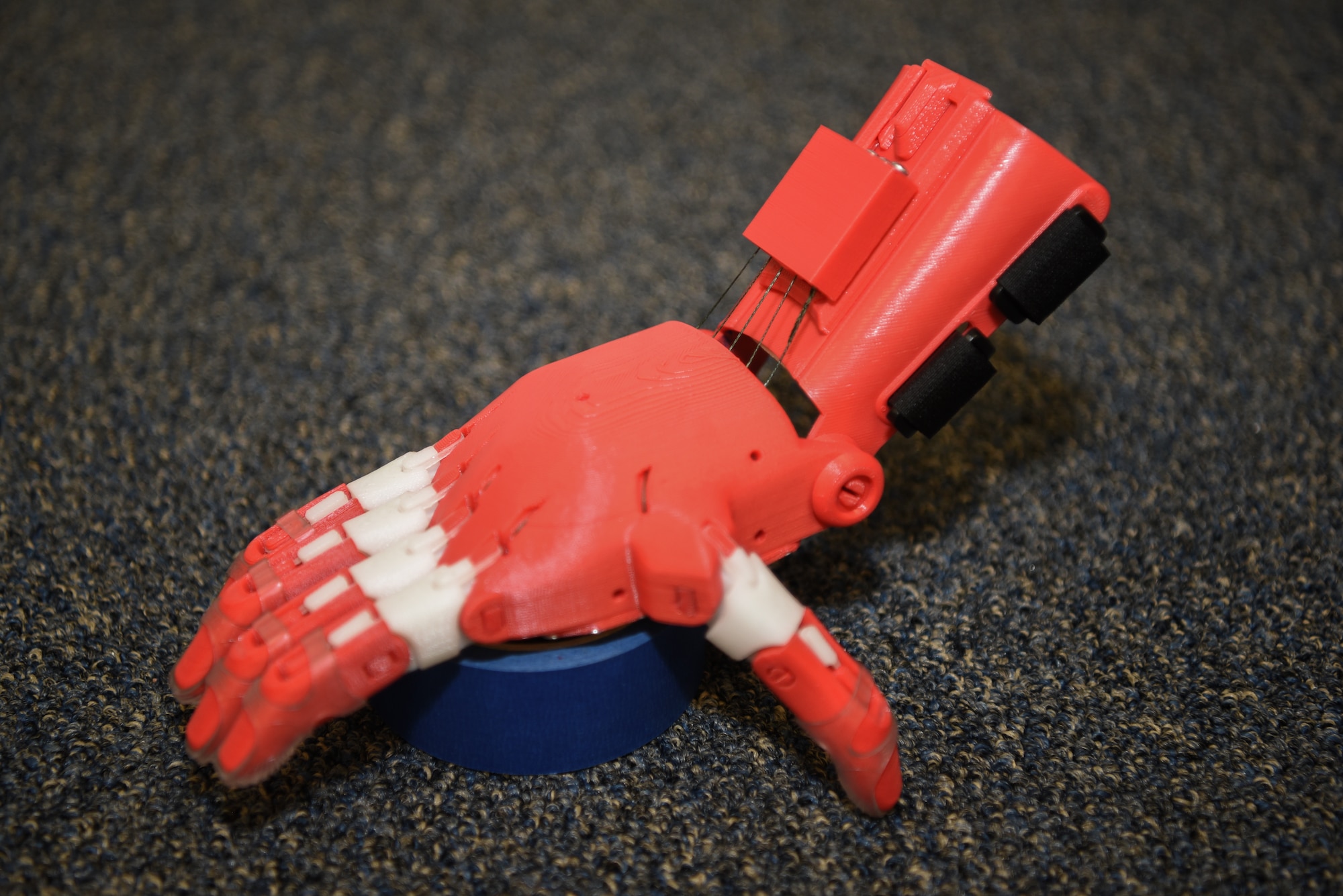 A prosthetic 3D printed hand is made by Tech Sgt. Zachary Zilm, 582nd Operation Support Squadron NCO in charge of group training, July 3, 2018, on F.E. Warren Air Force Base, Wyo. Zilm works through the organization Enabling the Future, a global network of passionate volunteers using 3D printing to give the world a “helping hand.” The hands go to children who do not have the option for traditional prosthetic devices.