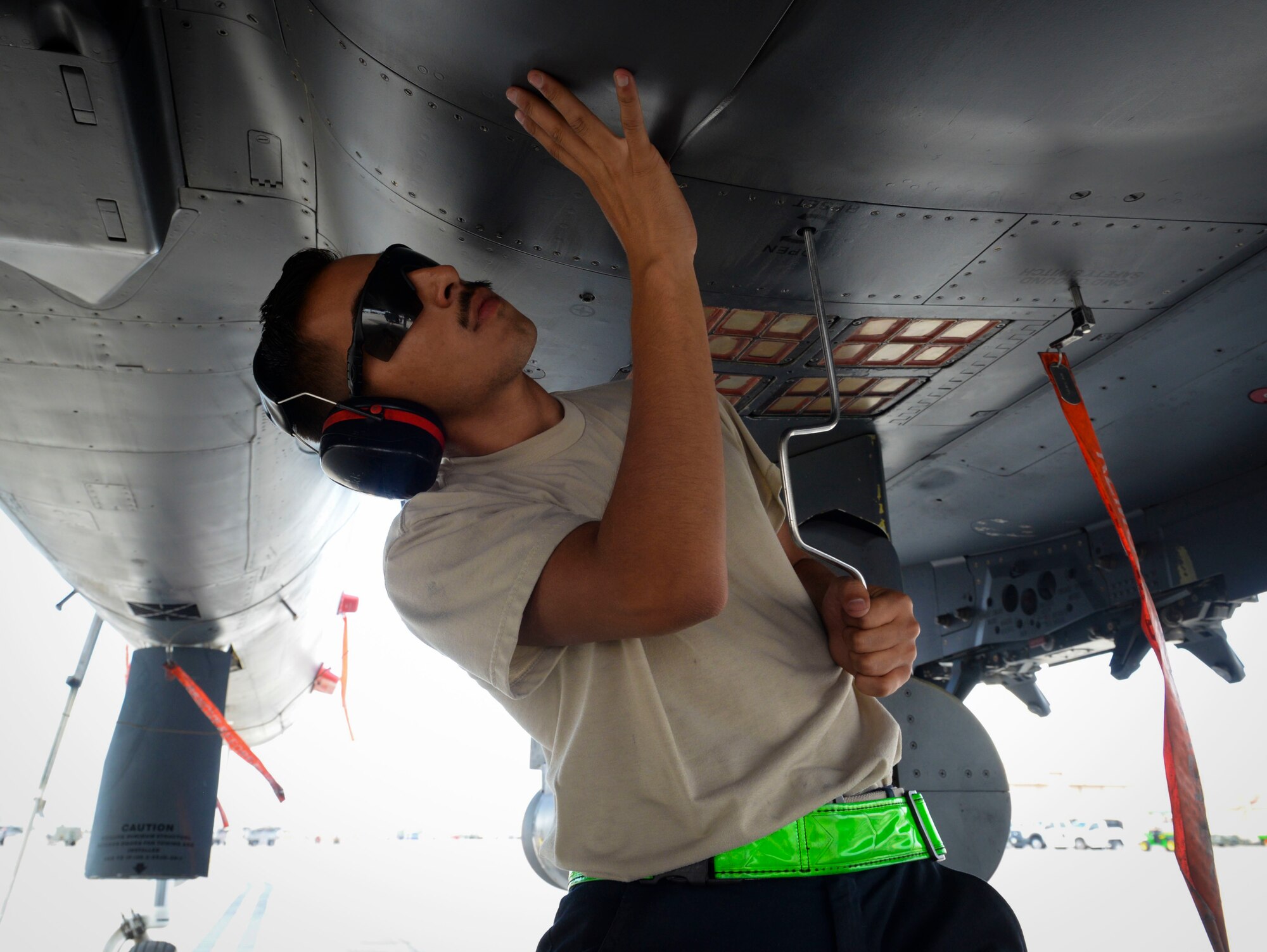 Airman 1st Class Bonifacio Garcia, F-15E Strike Eagle fighter jet assistant dedicated crew chief assigned to 757th Maintenance Squadron Strike Aircraft Maintenance Unit, prepares an F-15E Strike Eagle fighter jet for defueling at Nellis Air Force Base, Nevada. Dedicated crew chiefs and ADCCs are highly skilled maintainers with extensive knowledge of their aircraft. (U.S. Air Force photo by Airman Bailee A. Darbasie)