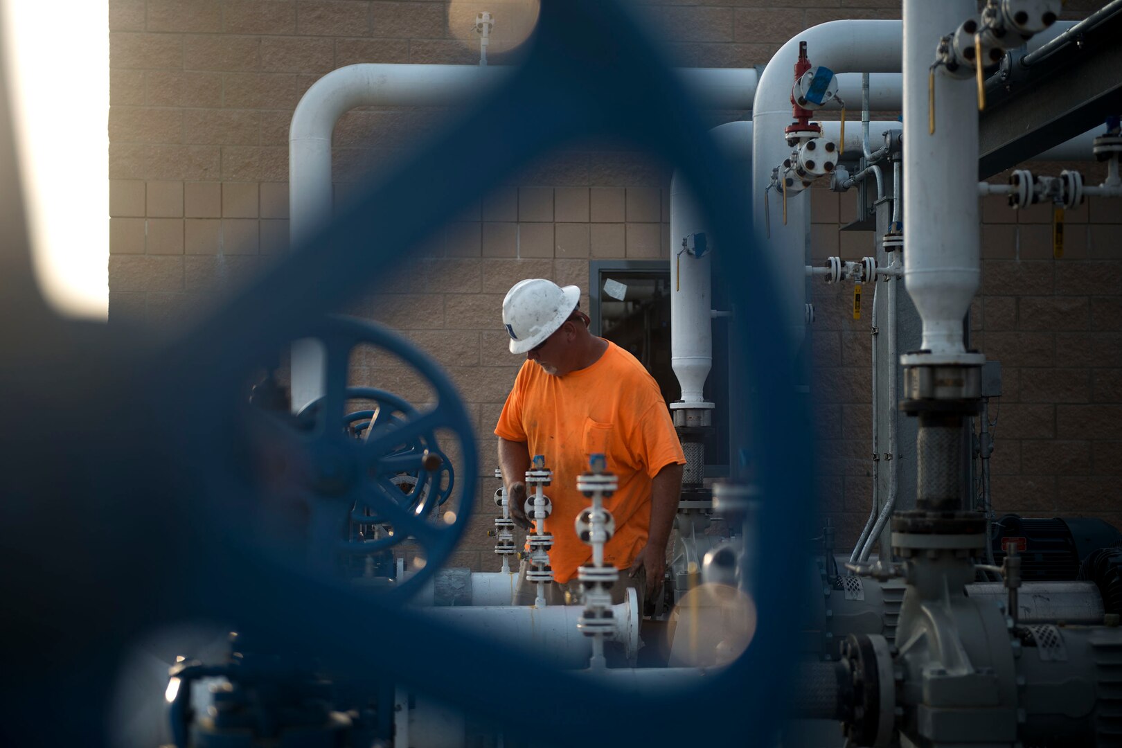 Kevin Kinsman, general foreman of pipefitting, constructs a gasket for the pump house in the 23d Logistics Readiness Squadron (LRS) fuel yard, July 18, 2018, at Moody Air Force Base, Ga. For the first time since the 1950s, the 23d LRS is modernizing the yard to improve fuel efficiency to enhance operations. (U.S. Air Force photo by Airman 1st Class Erick Requadt)