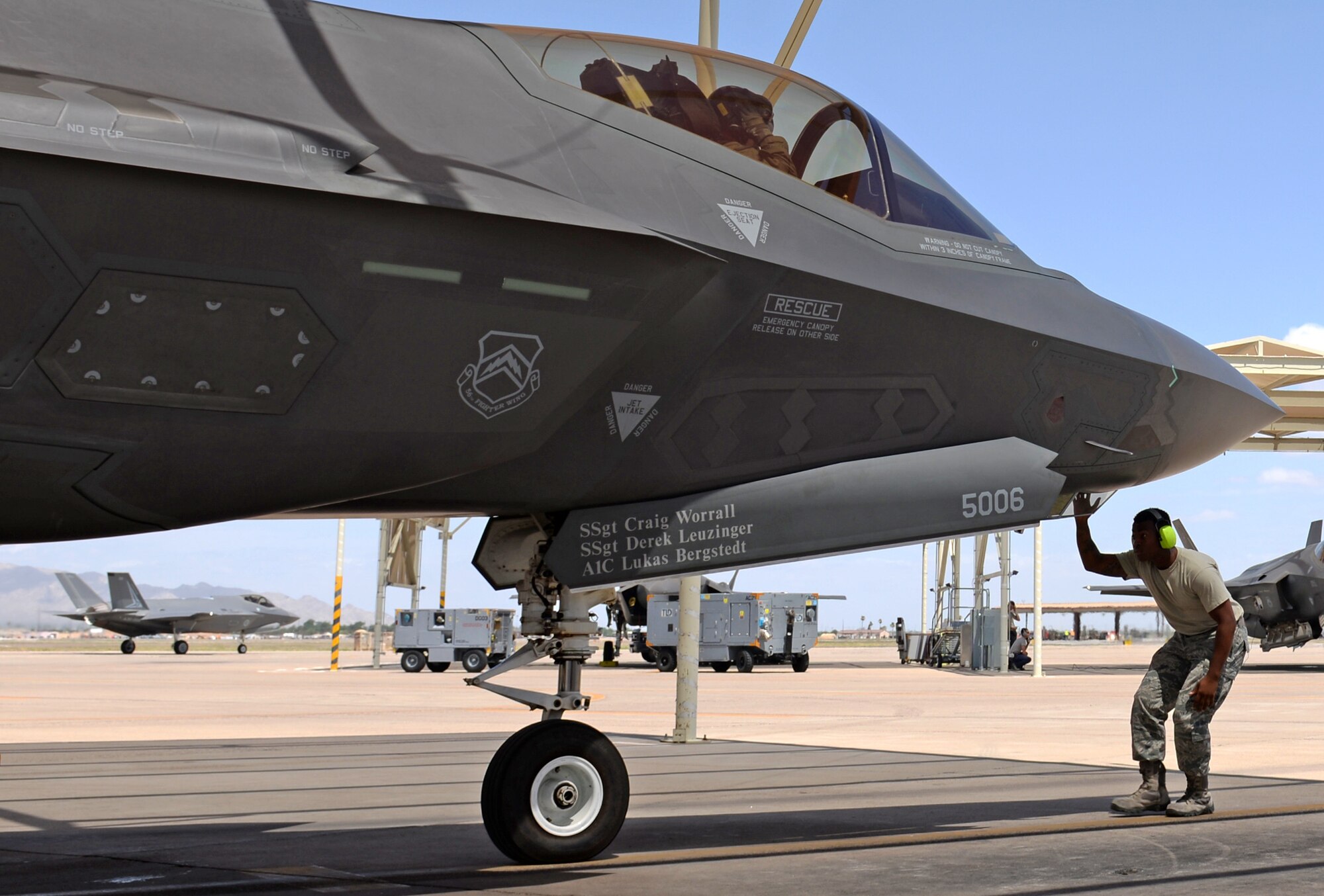 A 61st Aircraft Maintenance Unit maintainer inspects an F-35A Lightning II prior to its taxi-out and takeoff July 18, 2018, at Luke Air Force Base, Ariz. Pilots and maintainers perform thorough pre-flight checks before each sortie. (U.S. Air Force photo by Senior Airman Ridge Shan)