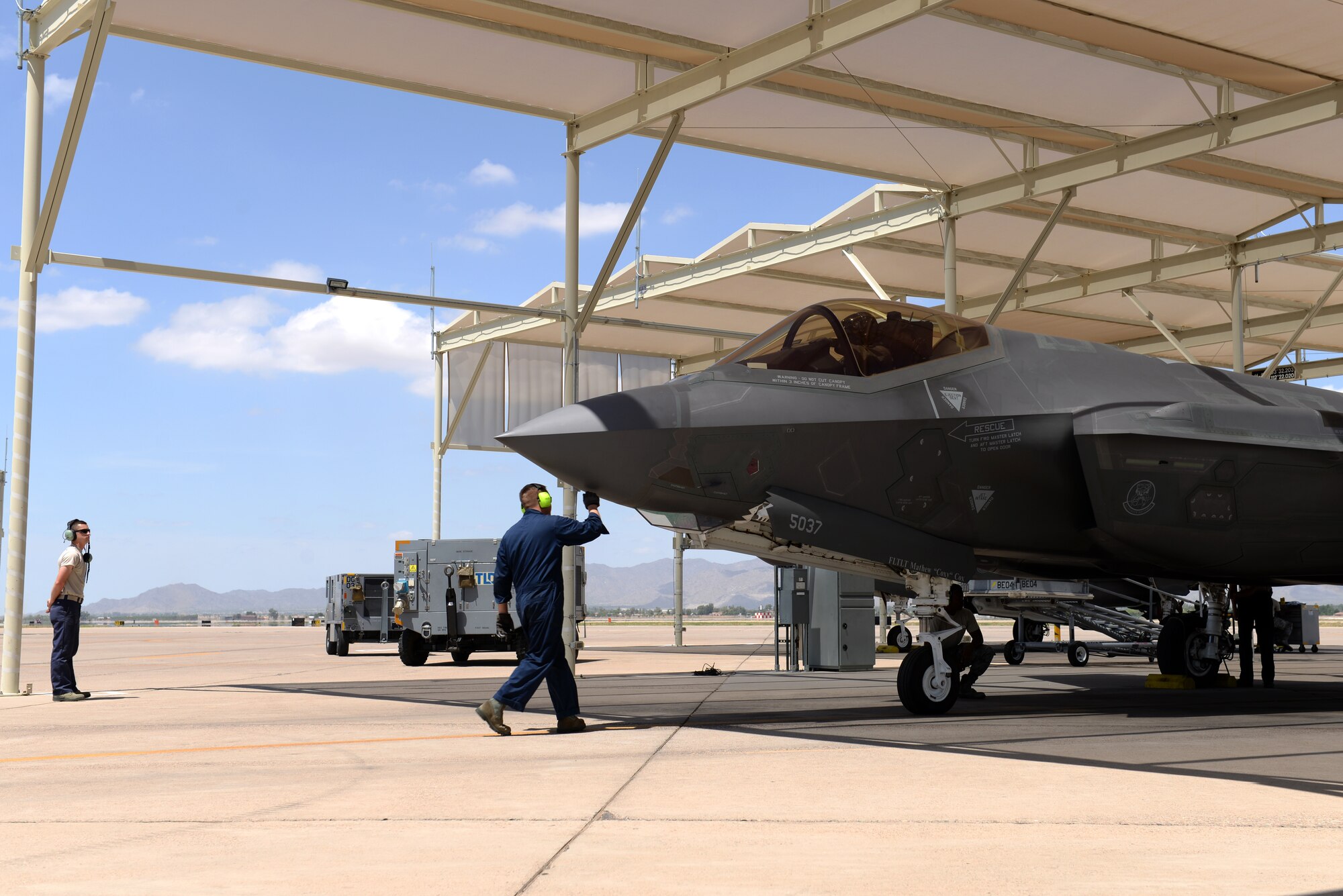 61st Aircraft Maintenance Unit maintainers inspects an F-35A Lightning II prior to its taxi-out and takeoff July 18, 2018, at Luke Air Force Base, Ariz. Pilots and maintainers perform thorough pre-flight checks before each sortie. (U.S. Air Force photo by Senior Airman Ridge Shan)