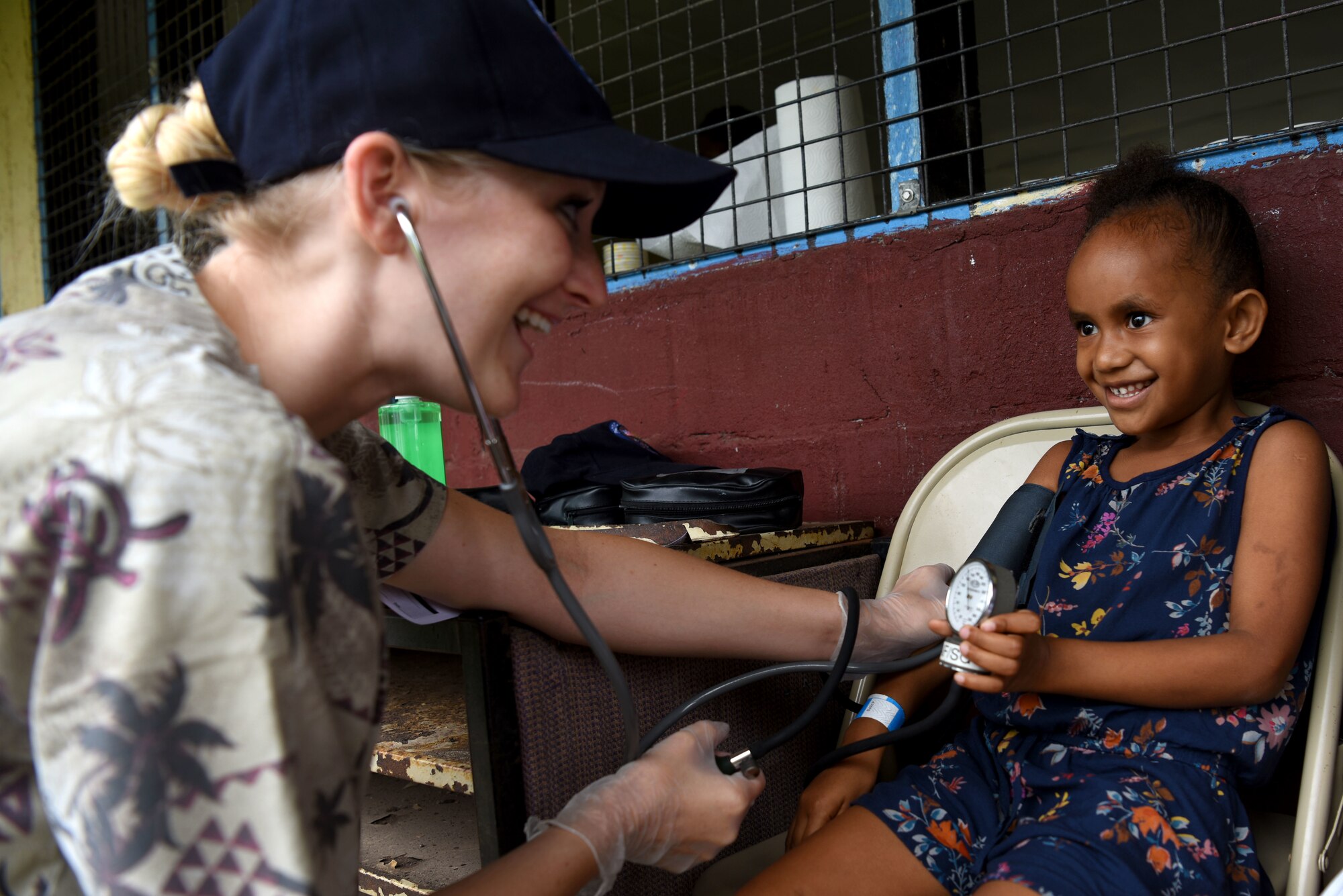 U.S. Air Force Staff Sgt. Kristen Hill, medical technician with the 152nd Medical Group, Nevada Air National Guard, checks a patient’s vitals at Tata Primary and Secondary School during Pacific Angel 18-3 in Luganville, Espiritu Santo Island, Vanuatu, July 16, 2018.