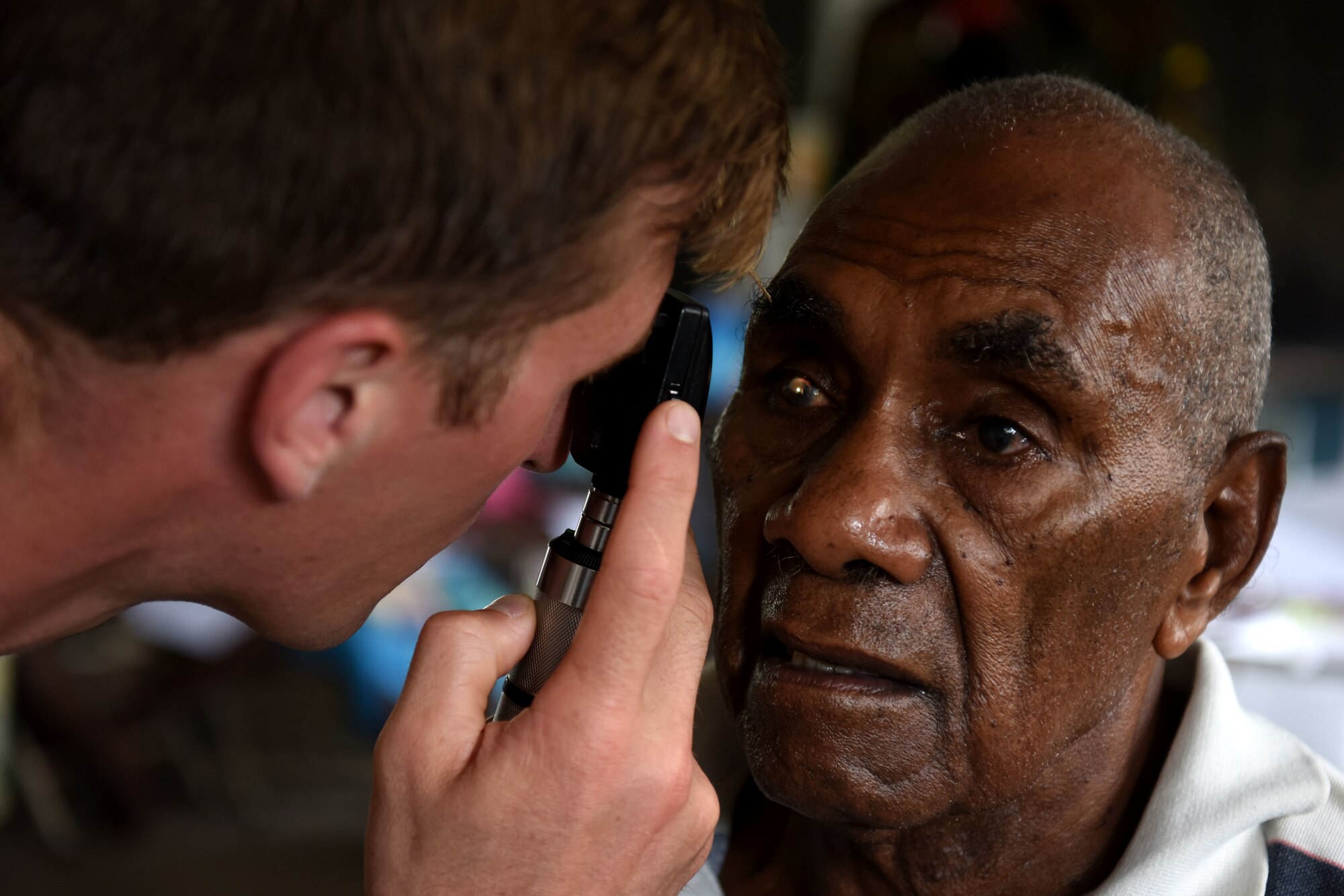 U.S. Air Force Capt. Eric Noll, an optometrist with the 354th Medical Group, Eielson Air Force Base, Alaska, checks a patient’s eyesight at Tata Primary and Secondary School during Pacific Angel 18-3 in Luganville, Espiritu Santo Island, Vanuatu, July 16, 2018.