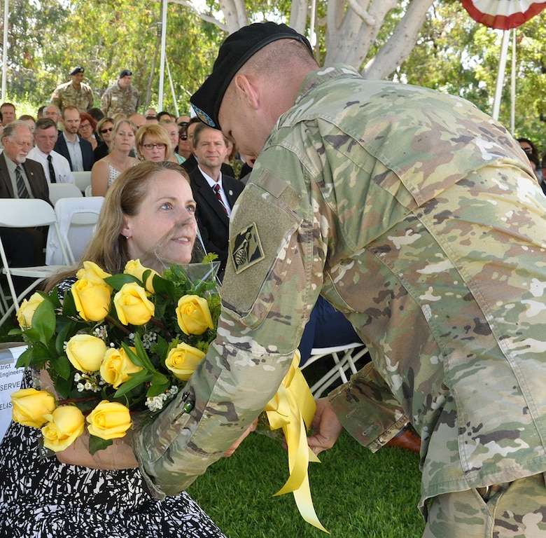 Melissa Barta, wife of Col. Aaron Barta, incoming U.S. Army Corps of Engineers Los Angeles District commander, receives flowers during a July 19 change of command ceremony at Fort MacArthur in San Pedro, California.