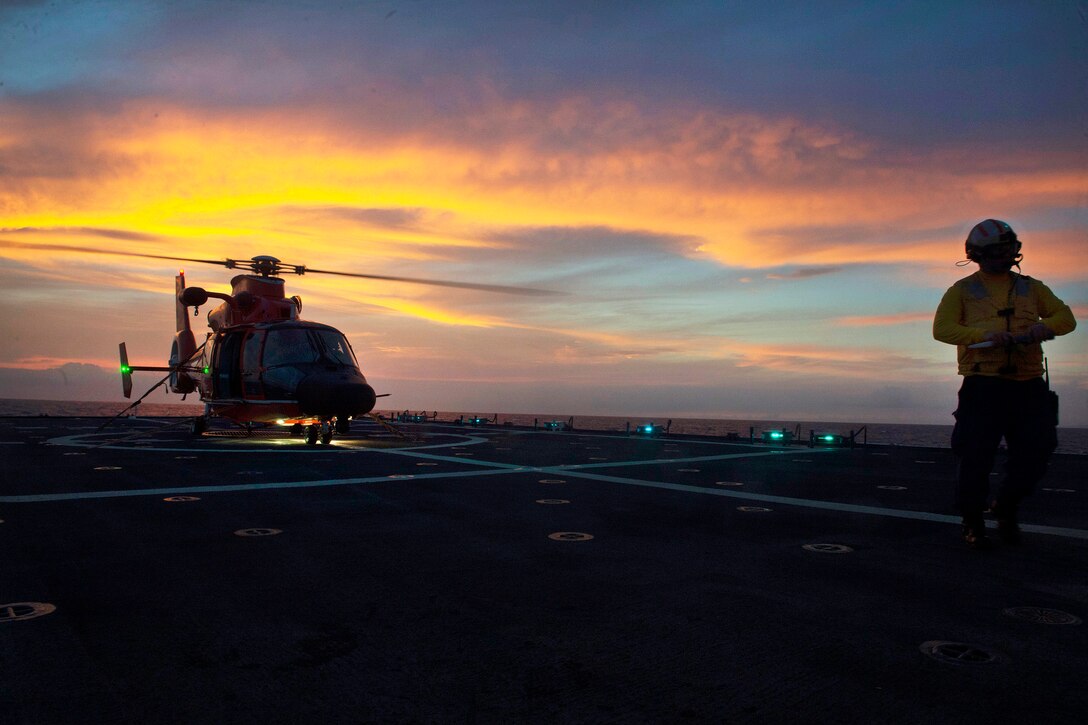 A helicopter prepares for takeoff.
