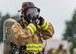 U.S. Marine Corps Cpl. Dahee Park, Marine Wing Support Squadron 171 Aircraft Rescue and Fire-Fighting specialist, adjusts her protective headgear