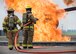 Yokota Air Base and Marine Corps Air Station Iwakuni firefighters prepare to battle a fire