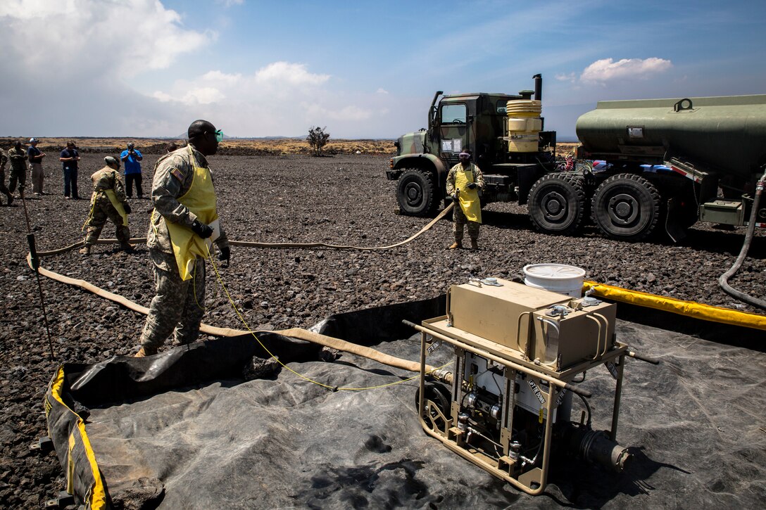 U.S. Army soldiers with the 25th Sustainment Brigade, 25th Infantry Division, set up an Expeditionary Mobile Fuel Additization Capability system during a field test as of part Rim of the Pacific (RIMPAC) exercise at Pohakuloa Training Area, Hawaii, July 18, 2018. RIMPAC provides high-value training for task-organized, highly capable Marine Air-Ground Task Force and enhances the critical crisis response capability of U.S. Marines in the Pacific.